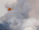 Canadian wildfires grow tenfold; rescuers pray for rain