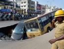 PHOTOS: Bus, car trapped in crater as Chennai road caves in