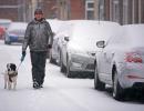 PHOTOS: Snow bomb hits UK, road, air travel disrupted