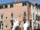 PHOTOS: Why giant hands are emerging from the water in Venice