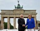 PM poses with Merkel at Brandenburg Gate before leaving Berlin