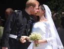 Sealed with a kiss! Harry and Meghan are husband and wife