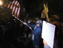 As US counts votes, protesters take to the streets