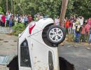 PIX: Car swallowed by Delhi road in monsoon