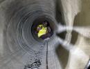 Trapped workers lifted rat miners on their shoulders