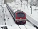 A Train Chugs Along In The Kashmir Snow