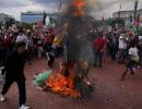 Netanyahu in Congress, protestors burn US flag outside