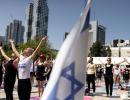 Amid war, hundreds join Yoga Day events in Israel