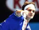 Federer eases into home-town quarter-finals