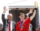 Spain land in Madrid with Cup to start festivities