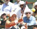 Bartoli ousted at Stanford, Stosur battles on