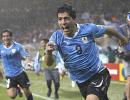 Suarez double puts Uruguay into last eight