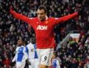 Five-star Berbatov puts Man Utd back on top