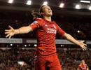 Carroll double helps Liverpool crush Man City