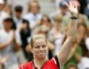 Clijsters survives scare to progress in Paris