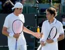 Photos: Isner-Mahut Wimbledon rematch a damp squib