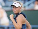 Wozniacki battles through, Clijsters out injured