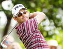 Oosthuizen leads Masters, Woods four back