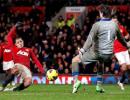 Man United win seven-goal thriller while City lose