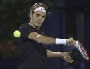 Federer cruises in Dubai as Murray labours