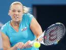 Clijsters eases into semis, Kanepi upsets Petkovic