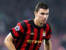 Dzeko heads gritty Man City clear at top