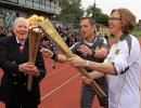 Bannister carries Olympic torch at site of famous mile