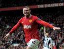 Rooney goals lift Man United top after City lose