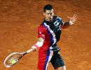 Djokovic downs Federer to set up Nadal final