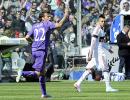 Fiorentina hold Milan in fight for Champions League place