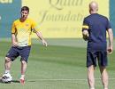 Barca's Messi returns to training camp