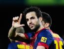 Late Fabregas goal moves Barca closer to title