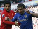 Suarez shows appetite for trouble, bites Chelsea defender