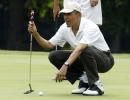 In a first, Obama playing golf with Tiger Woods