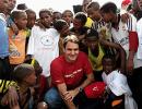 Federer plays big brother to village kids at charity event