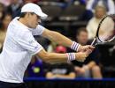 Isner survives opening Delray test, Nishikori quits