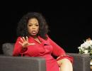 Incredulous Oprah sheds trademark warmth for Armstrong