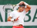 French Open PHOTOS: Nadal wobbles, Federer dances