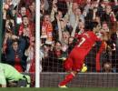 Suarez hat-trick keeps Liverpool on Arsenal's tail