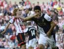 Suarez nets two on League return as Liverpool win