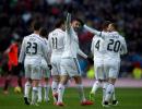 Benzema double sends Real four points clear