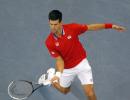 Serbia, France sail into Davis Cup last eight