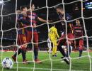 Champions League PIX: Barca drub Roma; Arsenal's hopes alive