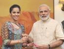 First Look: Saina presents her racquet to PM Modi