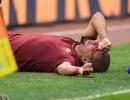 Euro football: Roma win bloody derby; Hamburg record 1st win