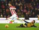 EPL PHOTOS: Arsenal go top after draw at Stoke; United win at Liverpool