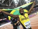 World C'ships PIX: McLeod wins hurdles; Rojas puts Venezuela on map