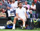 Laid low by sore knee, Wawrinka shown door by energetic Russian