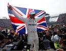 Hamilton collides but wins fourth title