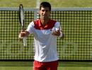 Djokovic says not among favourites at Wimbledon, backs Federer